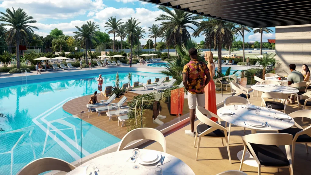 Piscina de lujo y terraza moderna integradas en el diseño de fraccionamiento Boca Chica con estilo tropical.